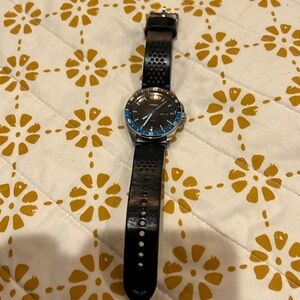 Very cute and stylish Fossil watch.  Black with blue trim on face.